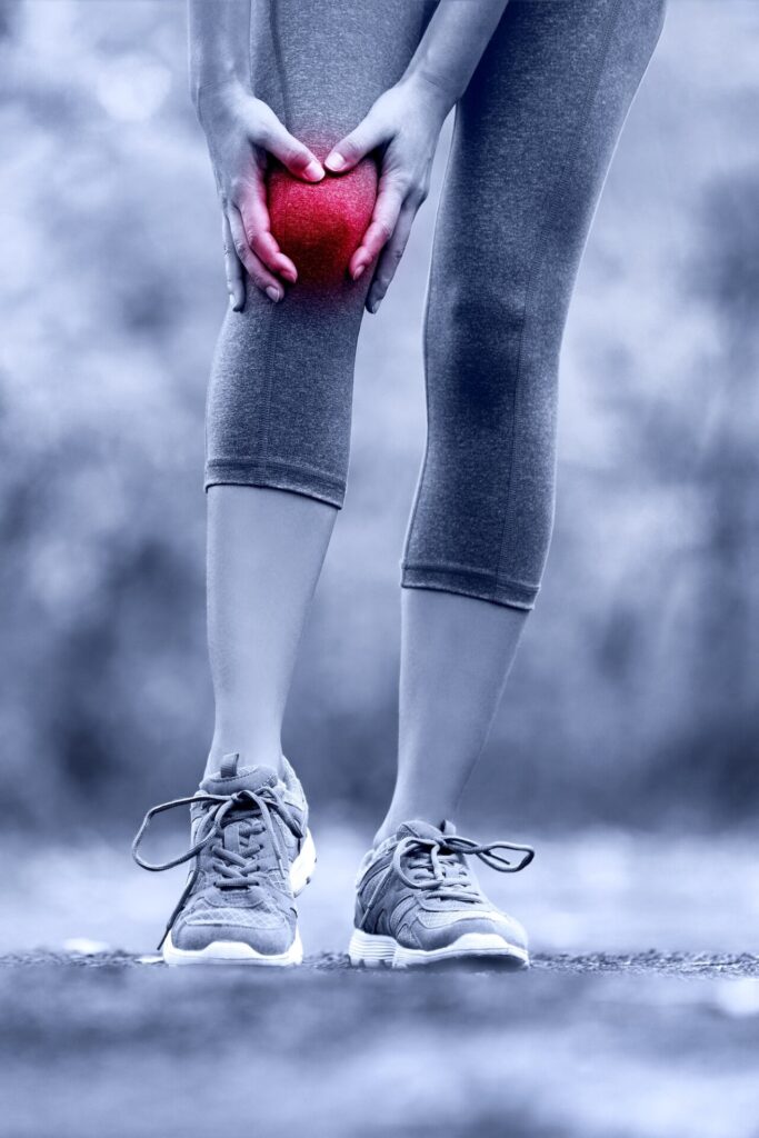 A runner holding his knee