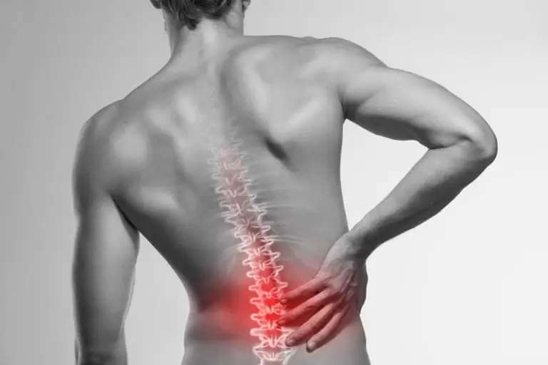 A man holding his lower back