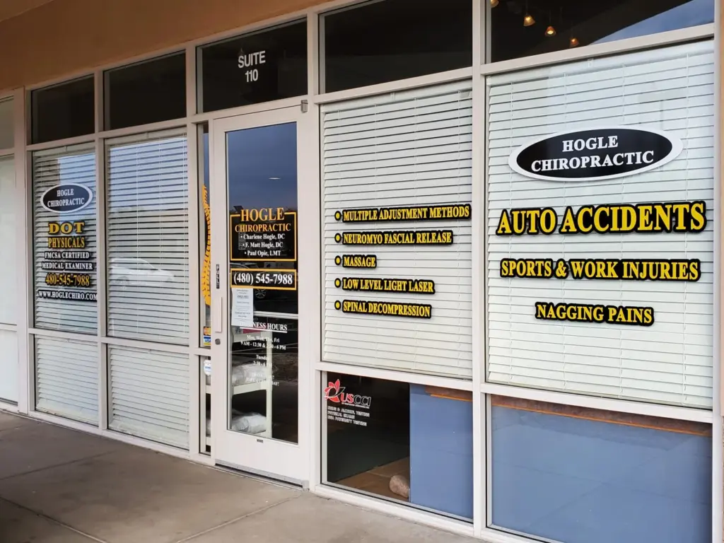 The Hogle Chiropractic storefront: window lettering for auto accidents, sports and work injuries and nagging pains